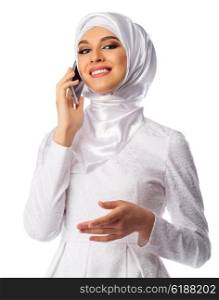 Young muslim woman with mobile phone isolated