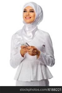 Young muslim woman with mobile phone isolated