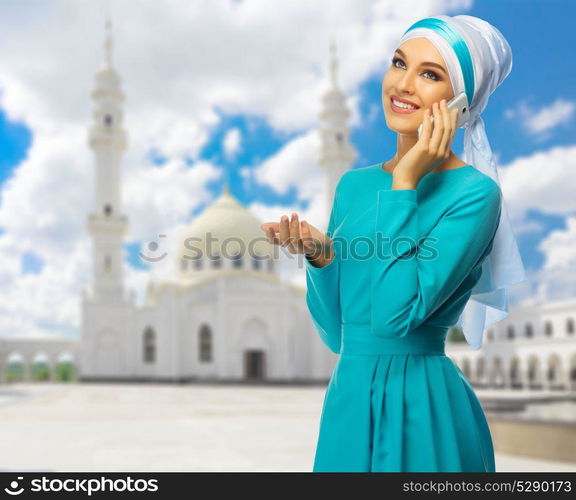 Young muslim woman with white mosque