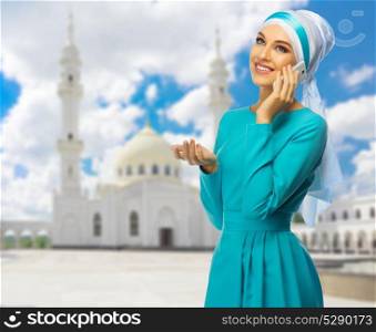 Young muslim woman with white mosque