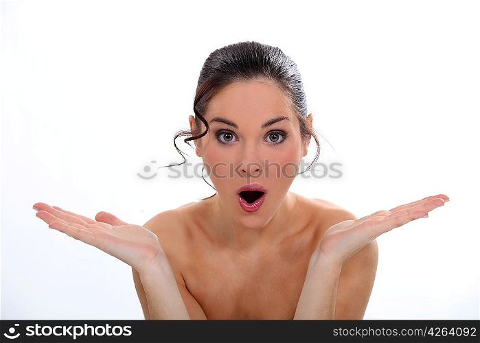 young naked woman looking surprised
