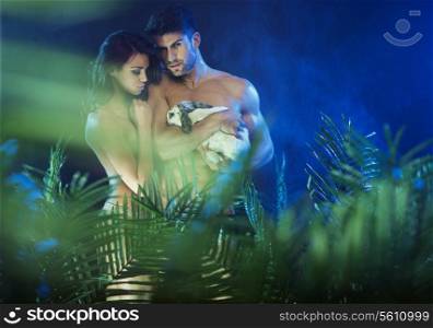 Young nude couple in the open outdoors