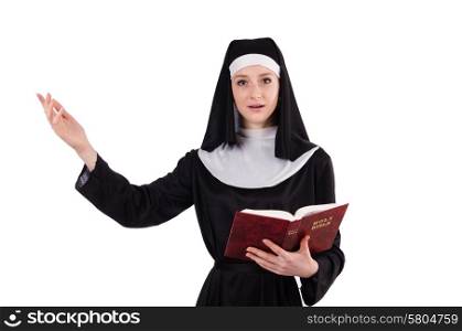 Young nun with bible isolated on white