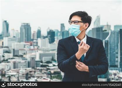 Young office worker with face mask quarantine from coronavirus or COVID-19. Concept of protective working environment to reopen business and stop spreading of coronavirus or COVID-19.