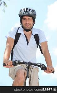 Young on bike with helmet