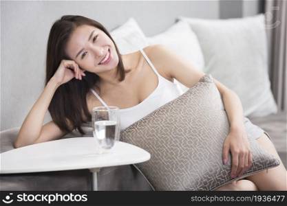Young oriental woman resting at home