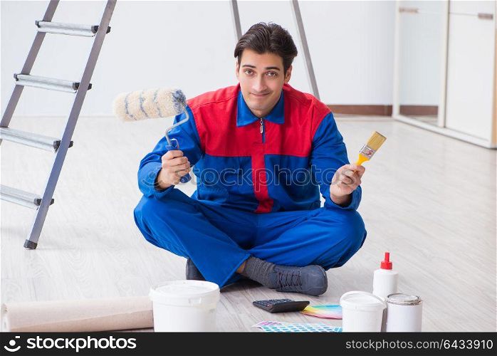 Young painter trying to match colours for painting job