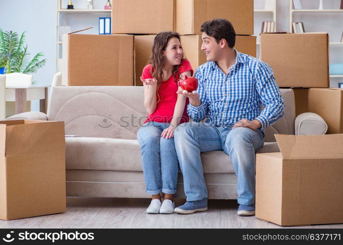 Young pair moving in to new house with boxes