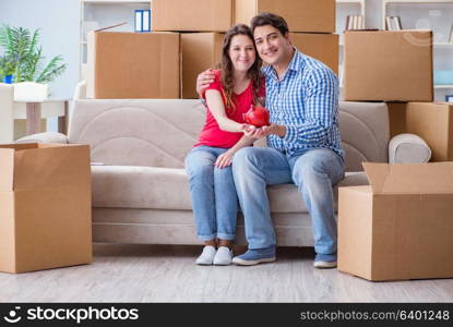 Young pair moving in to new house with boxes