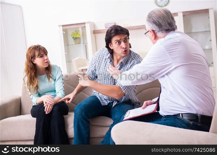 Young pair visiting experienced doctor psychologist . Young pair visiting experienced doctor psychologist
