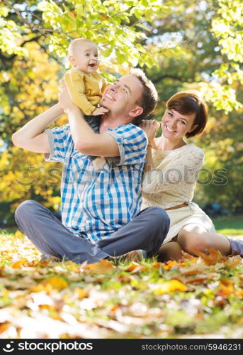 Young parents enjoying spare time with chiild