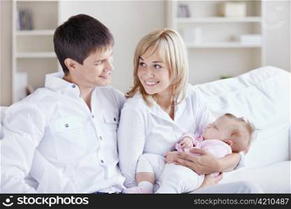 Young parents with babies at home