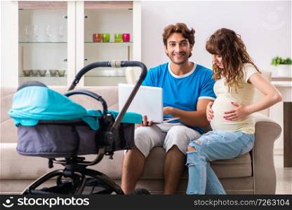 Young parents with baby expecting new arrival. The young parents with baby expecting new arrival