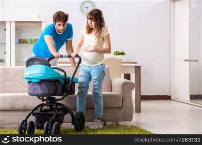 Young parents with baby expecting new arrival. The young parents with baby expecting new arrival