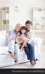 Young parents with her daughter at home