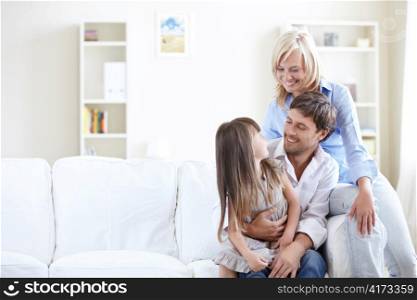Young parents with young daughter at home