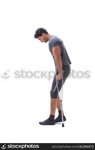 Young patient athlete sportsman suffering an injury trauma with . Young patient athlete sportsman suffering an injury trauma with crutches isolated on white