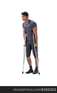 Young patient athlete sportsman suffering an injury trauma with . Young patient athlete sportsman suffering an injury trauma with crutches isolated on white