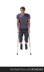 Young patient athlete sportsman suffering an injury trauma with . Young patient athlete sportsman suffering an injury trauma with crutches isolated on white