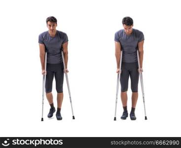 Young patient athlete sportsman suffering an injury trauma with crutches isolated on white. Young patient athlete sportsman suffering an injury trauma with 