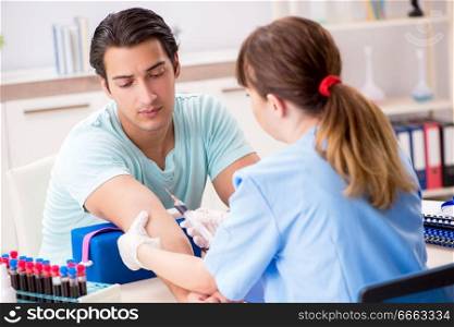 Young patient during blood test s&ling procedure  
