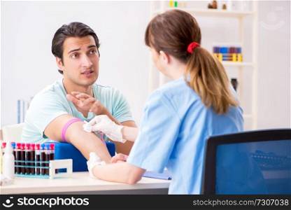 Young patient during blood test s&ling procedure  