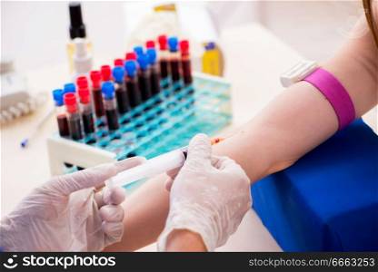 Young patient during blood test sampling procedure