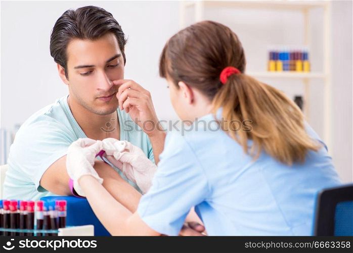 Young patient during blood test sampling procedure  . The young patient during blood test sampling procedure  