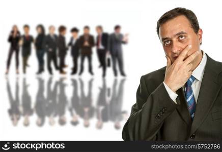 young pensive business man in front of a group of people