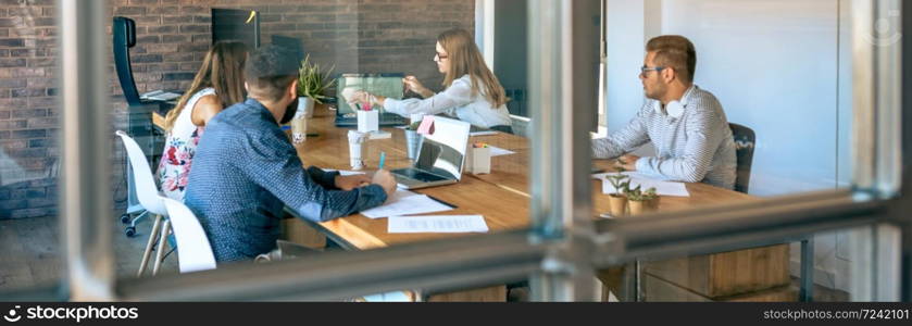 Young people at a business meeting in the office. People at a business meeting in the office