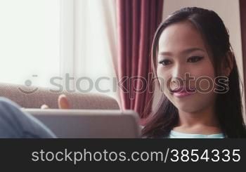 Young people at home, lifestyle and technology, portrait of happy beautiful Asian woman using ipad digital tablet for social network, internet and e-mail. 4of22