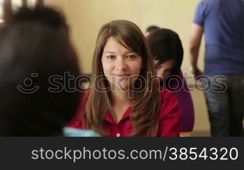 Young people at university, portrait of happy caucasian teenager smiling during test in college