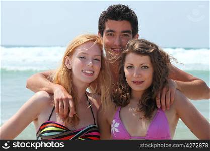 Young people hanging out on the beach