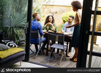 Young people have lunch in the backyard