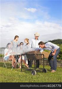 young people having barbecue