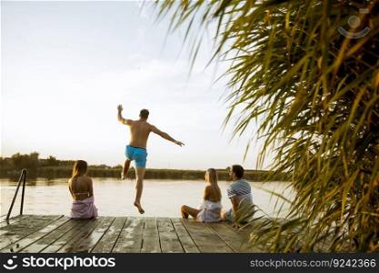 Young people having fun at the lake on a summer day