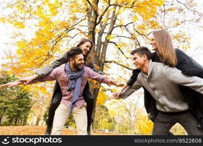 Young people having fun in the autumn park