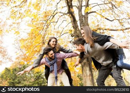 Young people having fun in the autumn park