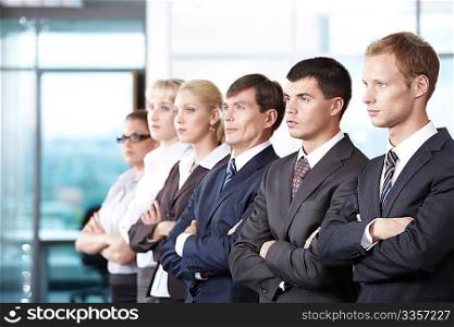 Young people in business suits look into the distance