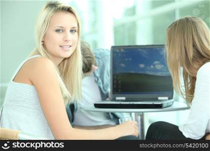 Young people looking at laptop