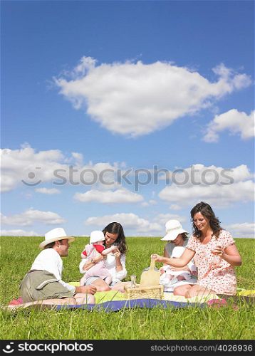young people on picnic blanket