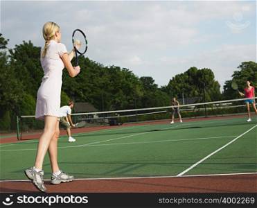 Young people playing tennis
