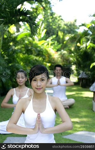 Young people practing yoga