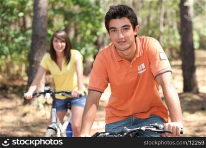 young people riding bikes