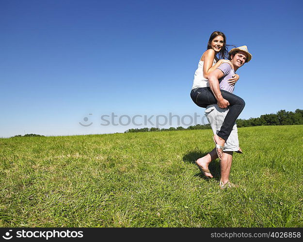 young people riding piggy back