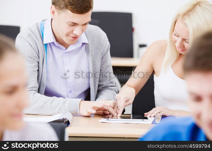 Young people sitting in classroom at lecture. Students at lesson