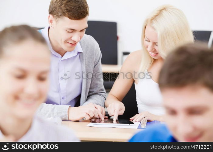 Young people sitting in classroom at lecture. Students at lesson