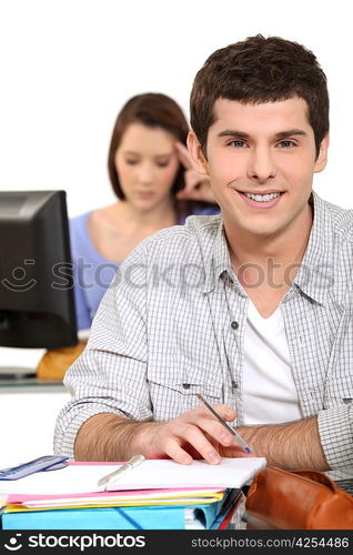 young people studying in a classroom