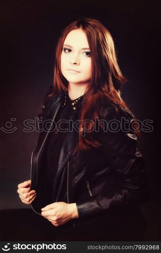 Young people teenage concept - beauty pensive serious woman teenager girl in rock goth style portrait on black