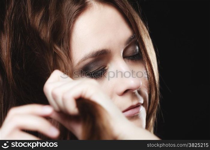 Young people teenage concept - pensive serious woman teenager girl closed eyes portrait on black